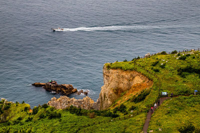 High angle view of rocks by sea