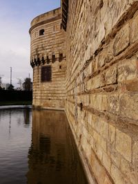 View of old building by lake