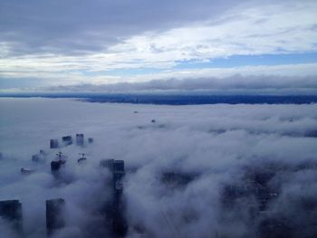 High angle view of fog covered landscape against sky