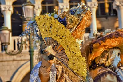 Side view of women wearing mask and costume during carnival