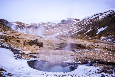 Scenic view of snowcapped mountains against clear sky