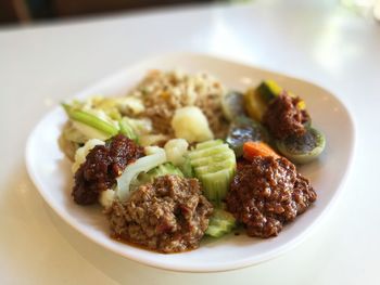 Close-up of served food in plate