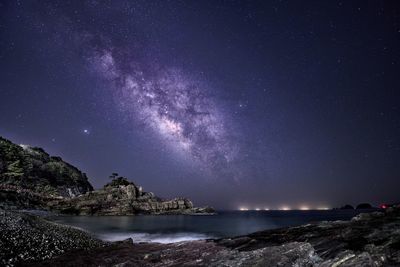 Scenic view of sea against sky at night