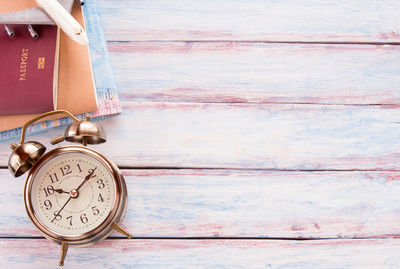 Open book on table against wall