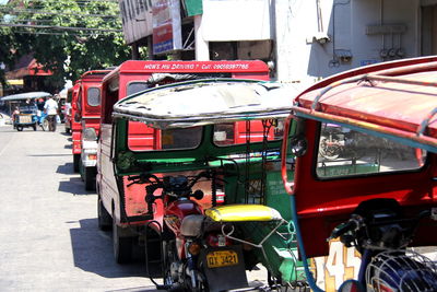 Jinrikishas parked on street