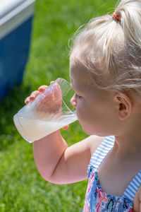 Close-up of girl drinking glass