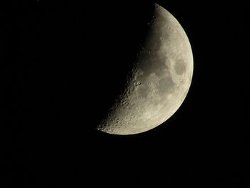 Low angle view of moon against sky at night