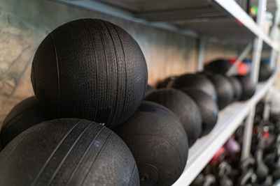 Close-up of balls in shelf at shop for sale