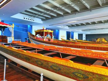 People in boat against ceiling