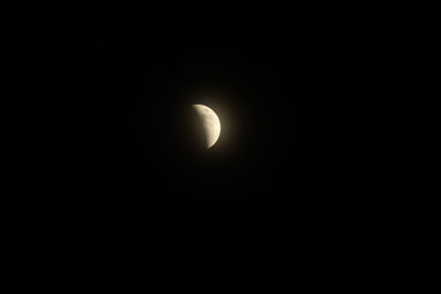 Low angle view of moon against clear sky at night