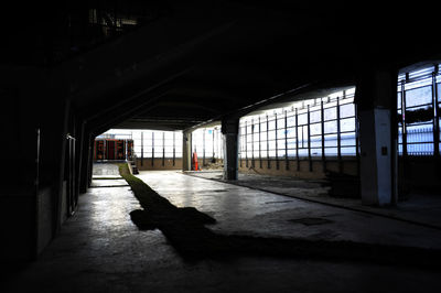 Silhouette of people at railroad station platform