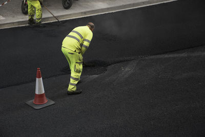 Full length of man standing on road