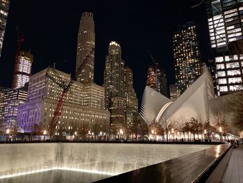 Illuminated buildings in city at night