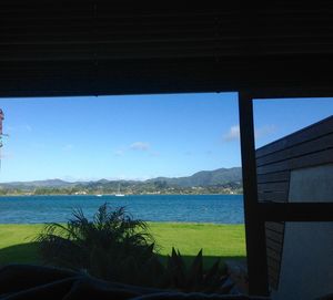 Scenic view of sea seen through window