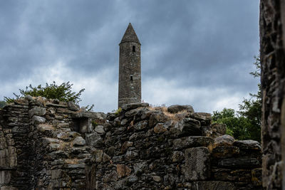 Low angle view of old building against sky