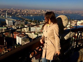 Woman looking at cityscape