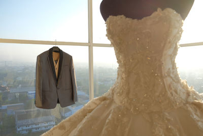 Man suits and wedding dresses are very romantic exposed to the warm morning sun.