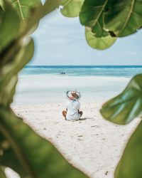 Full length of man on beach against sky