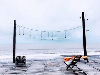 Pier on sea against sky