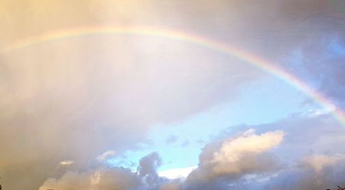 Low angle view of rainbow against sky