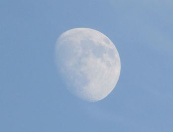 Low angle view of moon against clear sky at night