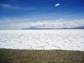 Scenic view of landscape against cloudy sky