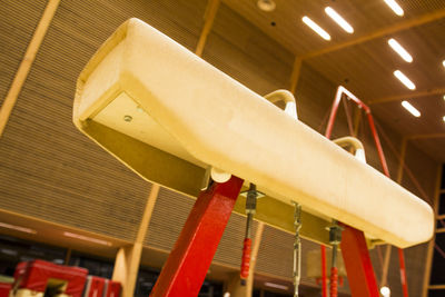 Low angle view of electric lamp hanging on ceiling