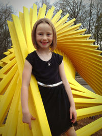 Portrait of young woman standing in boat
