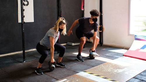 Couple exercising at gym