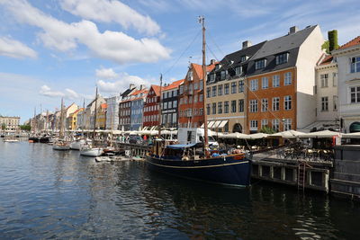 Boats in river in city