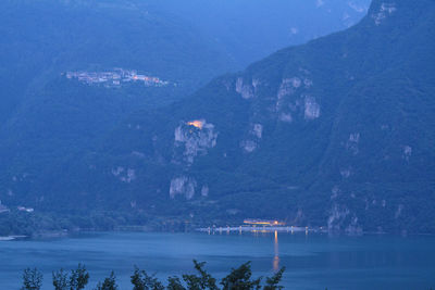 Night view of lake idro, bondone, baitoni and castle san giovanni in the province of trento, italy.