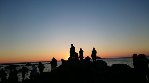 Silhouette of people on beach