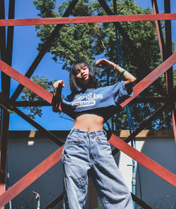 Full length of young woman standing on field