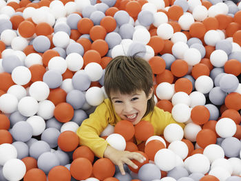 Happy boy playing with balls