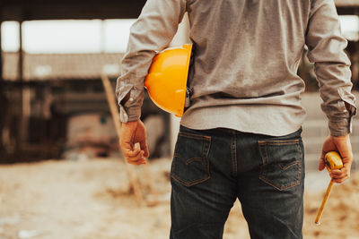Midsection of man working at construction site