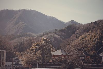 High angle view of townscape and mountains against sky