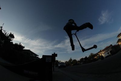 Low angle view of people against sky