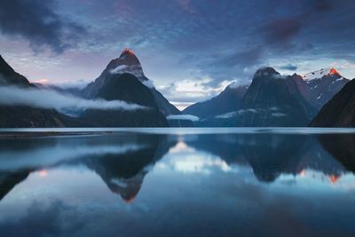 Scenic view of lake and mountains against sky