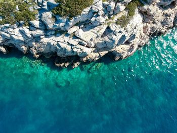 High angle view of rock formation in sea