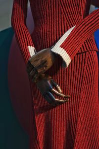 Close-up view of mannequin with warm clothing at store