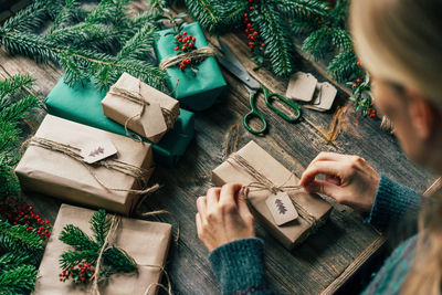 High angle view of woman holding gift box