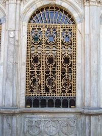 Low angle view of ornate window in temple