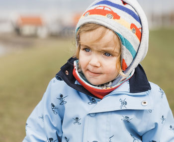 Close-up of cute baby girl wearing warm clothing during winter