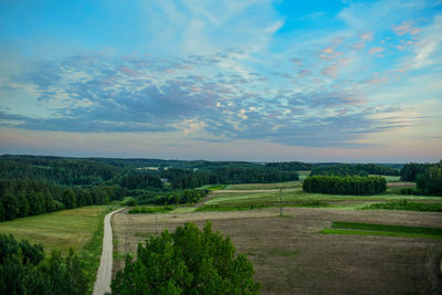 Scenic view of agricultural landscape against sky