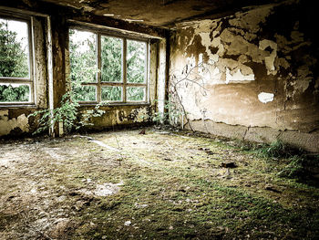 Damaged window in abandoned building