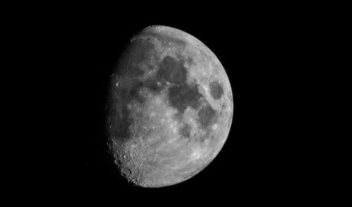 Low angle view of moon against sky at night