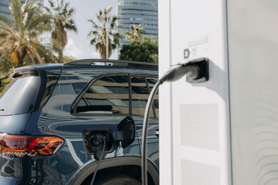 Electric car charging at station