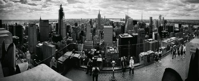 High angle view of modern buildings in city against sky