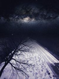 Scenic view of snow against sky at night