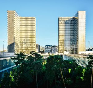 Low angle view of modern buildings against clear sky